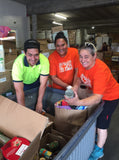 volunteers pack groceries at Auckland City Mission